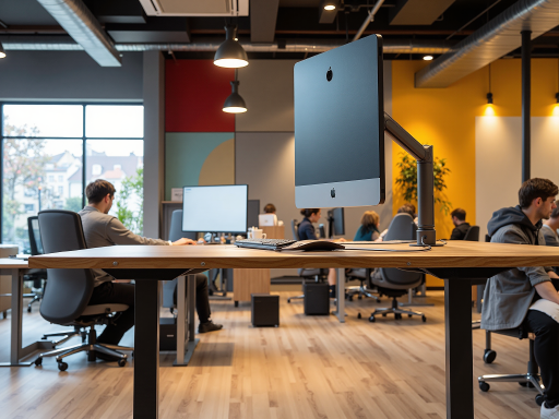 Professional team overview showing diverse group of technology experts working together in a modern office environment with computers and collaborative workspace